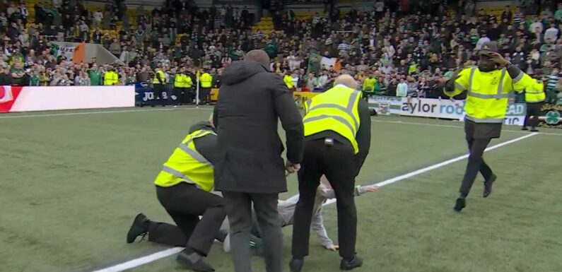 Rodgers rushes to push steward off young Celtic fan who got tackled to floor