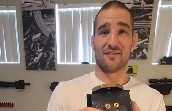 Sean Strickland shows off broken UFC belt – but fans can’t stop staring at walls