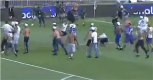 Brazilian football chaos as over 100 fans burst onto pitch and scrap each other