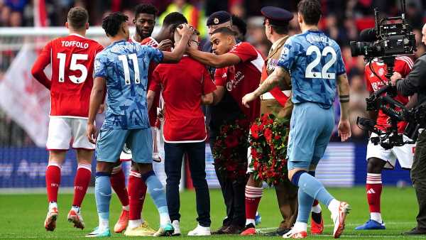 Nottingham Forest and Aston Villa players console distraught young fan